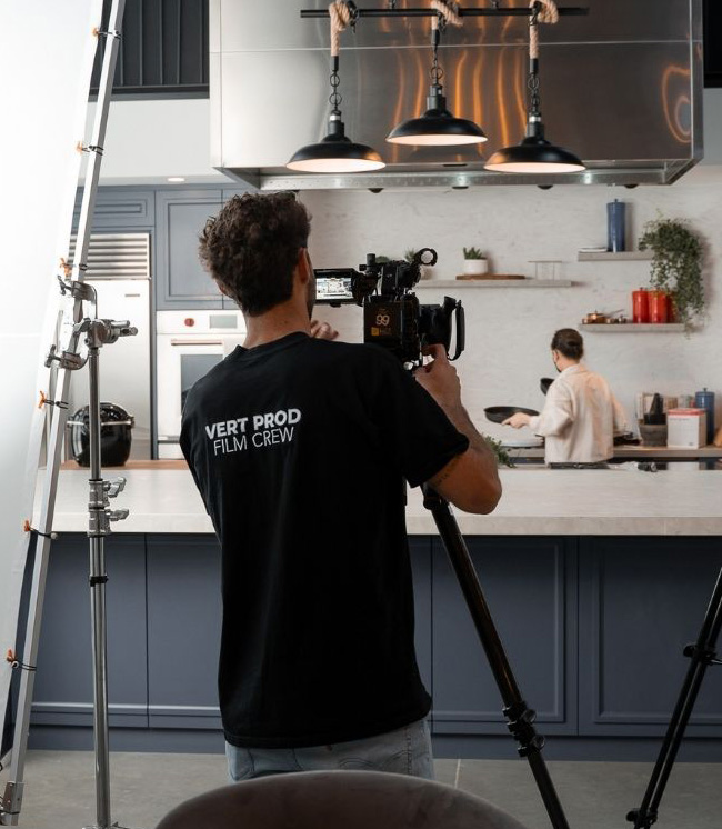 Music producer reviewing tour budget on a laptop in a studio